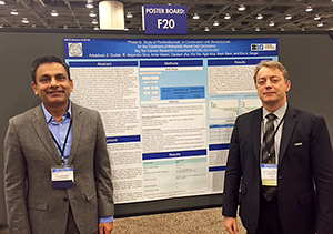 Gautam Jha, MD, (left) of the University of Minnesota, and Arkadiusz Dudek, MD, PhD, of the University of Illinois at Chicago, are pictured during the BTCRC-GU14-003 Phase Ib poster session at GU ASCO.