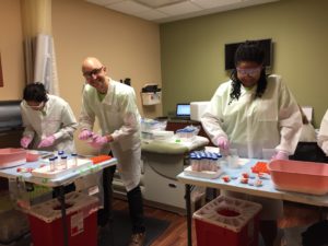 Amruta Phatak of Indiana University and Dr. Justin Colacino and Chanese Forte of the University of Michigan process breast tissue during the recent Susan G. Komen Tissue Bank at the IU Simon Cancer Center collection event in Detroit.